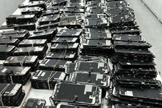 Stacks of iPhone back glass assemblies ready for reglass and top glass replacement — wholesale supplies for phone repair shops in NZ & AU